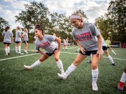 MSU soccer players stretching.